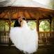 columbia missouri wedding photographer: a bride and groom kiss at gazebo