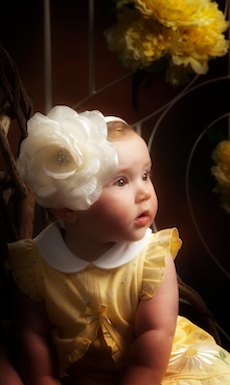 Baby portrait with yellow flowers